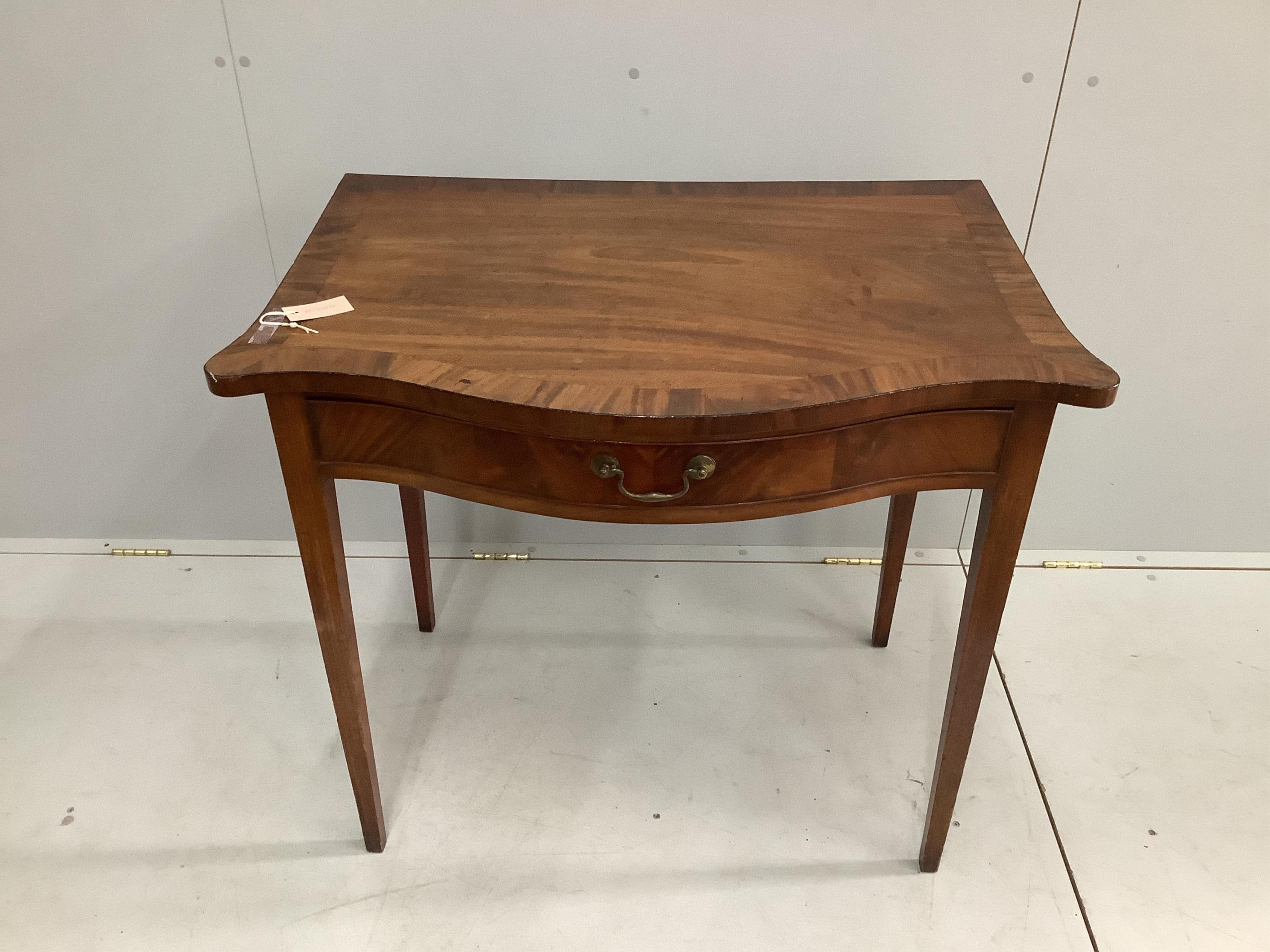 A George III banded mahogany serpentine serving table, width 91cm, depth 58cm, height 82cm. Condition - fair